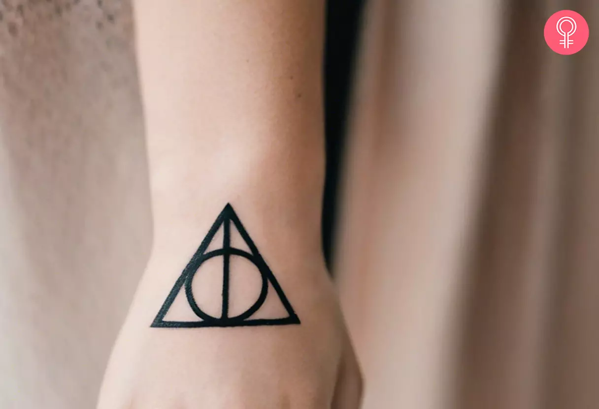 Deathly Hallows tattoo on the back of the palm