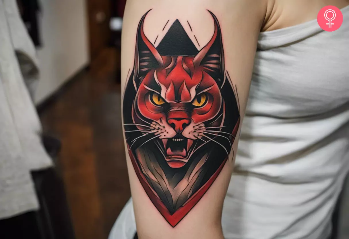 Demon cat tattoo on the arm