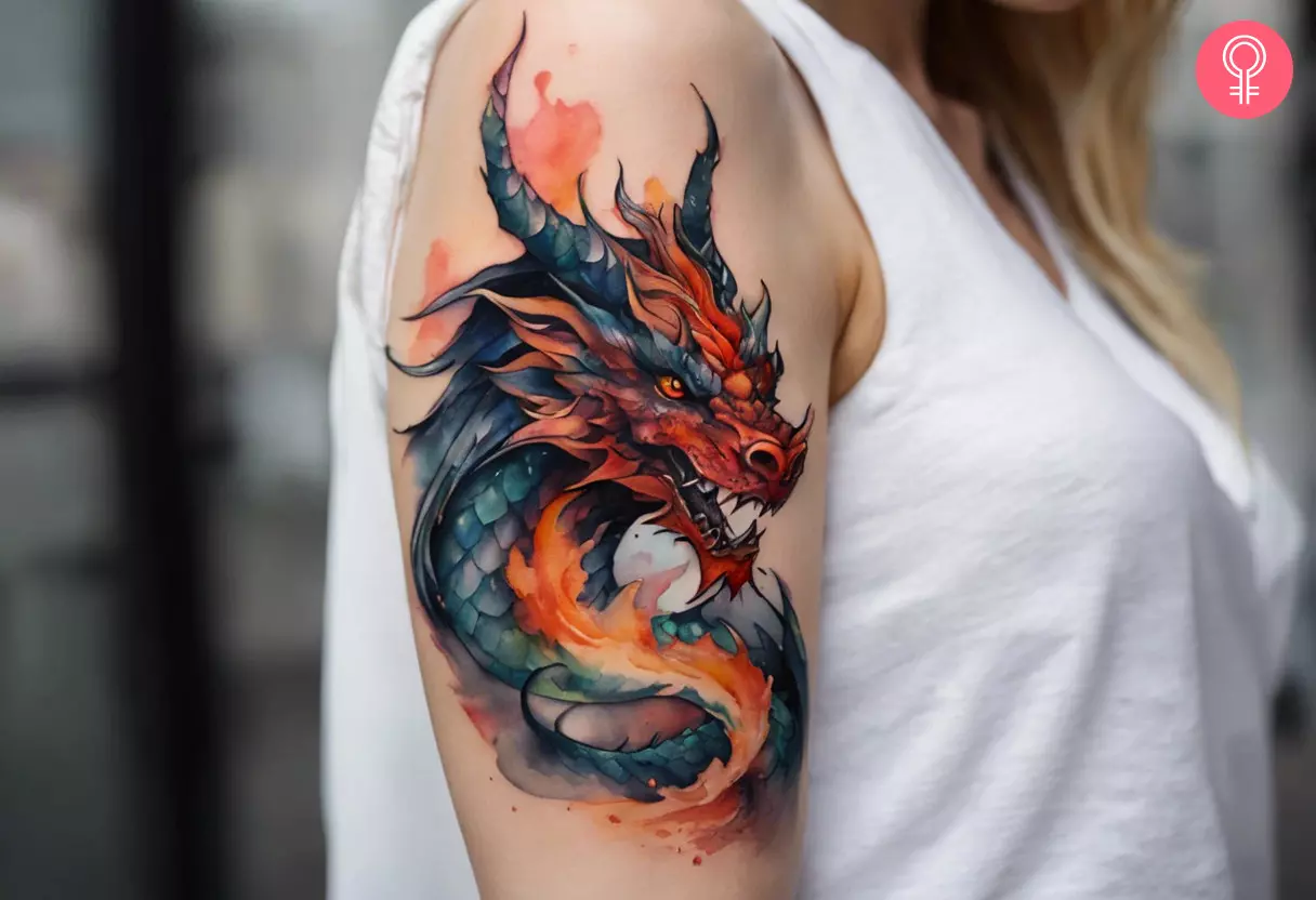 Demon dragon tattoo on the upper arm