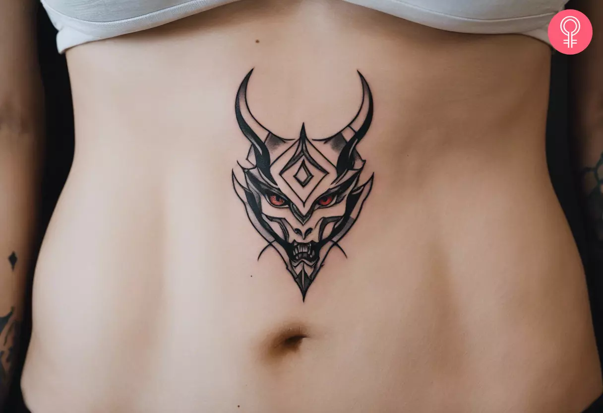 Demon lady tattoo on the abdomen