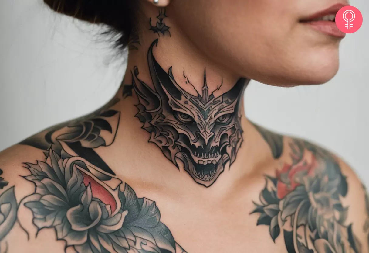 Demon tattoo on the throat