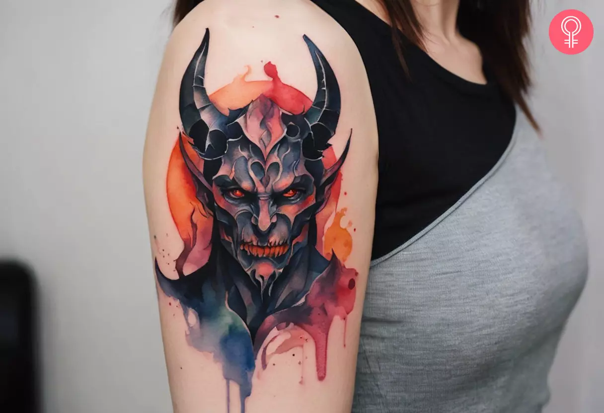 Demonic tattoo on the upper arm
