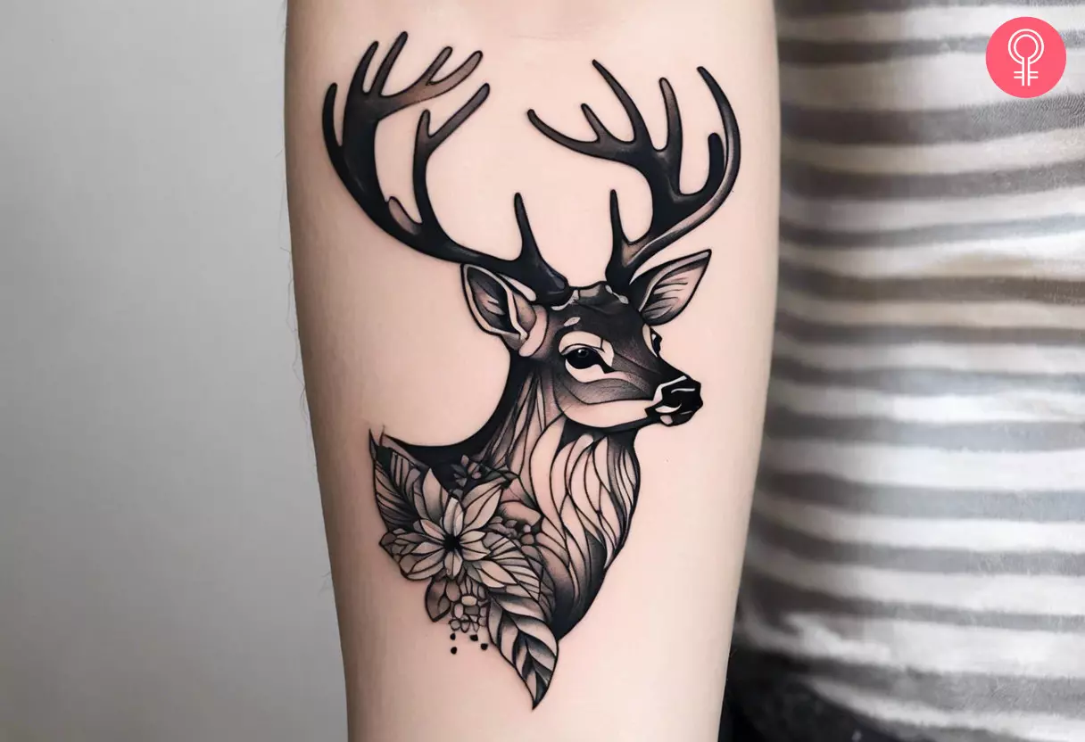 Geometric deer head tattoo on the forearm