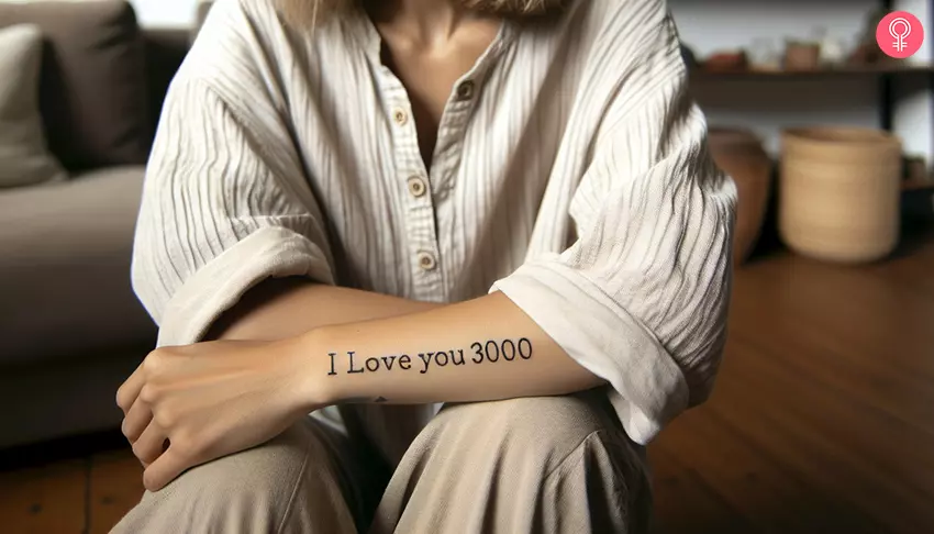 I Love You 3000 text tattoo on the wrist