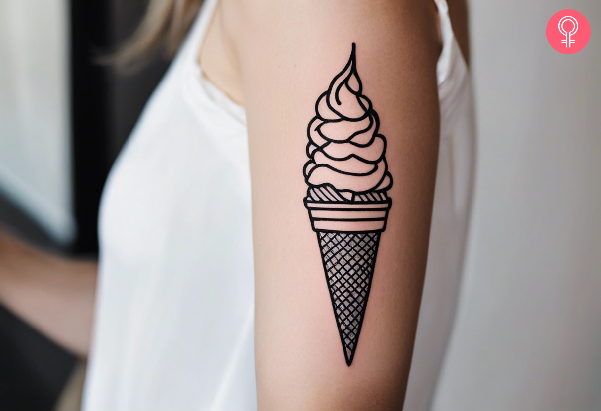 A woman with an ice cream cone tattoo on her upper arm
