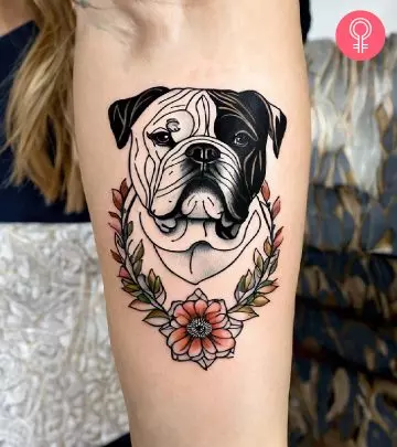 A woman with a cartoon dog tattoo on her lower arm