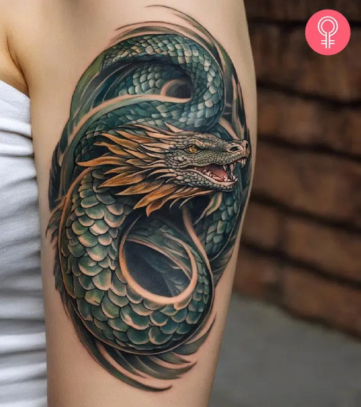 Jormungandr tattoo on the upper arm