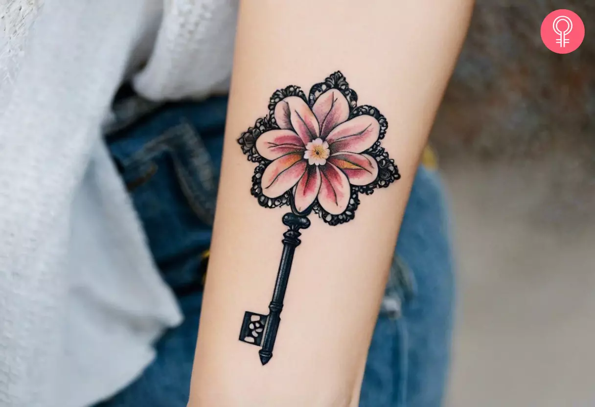 A woman with a floral head key tattoo on her forearm