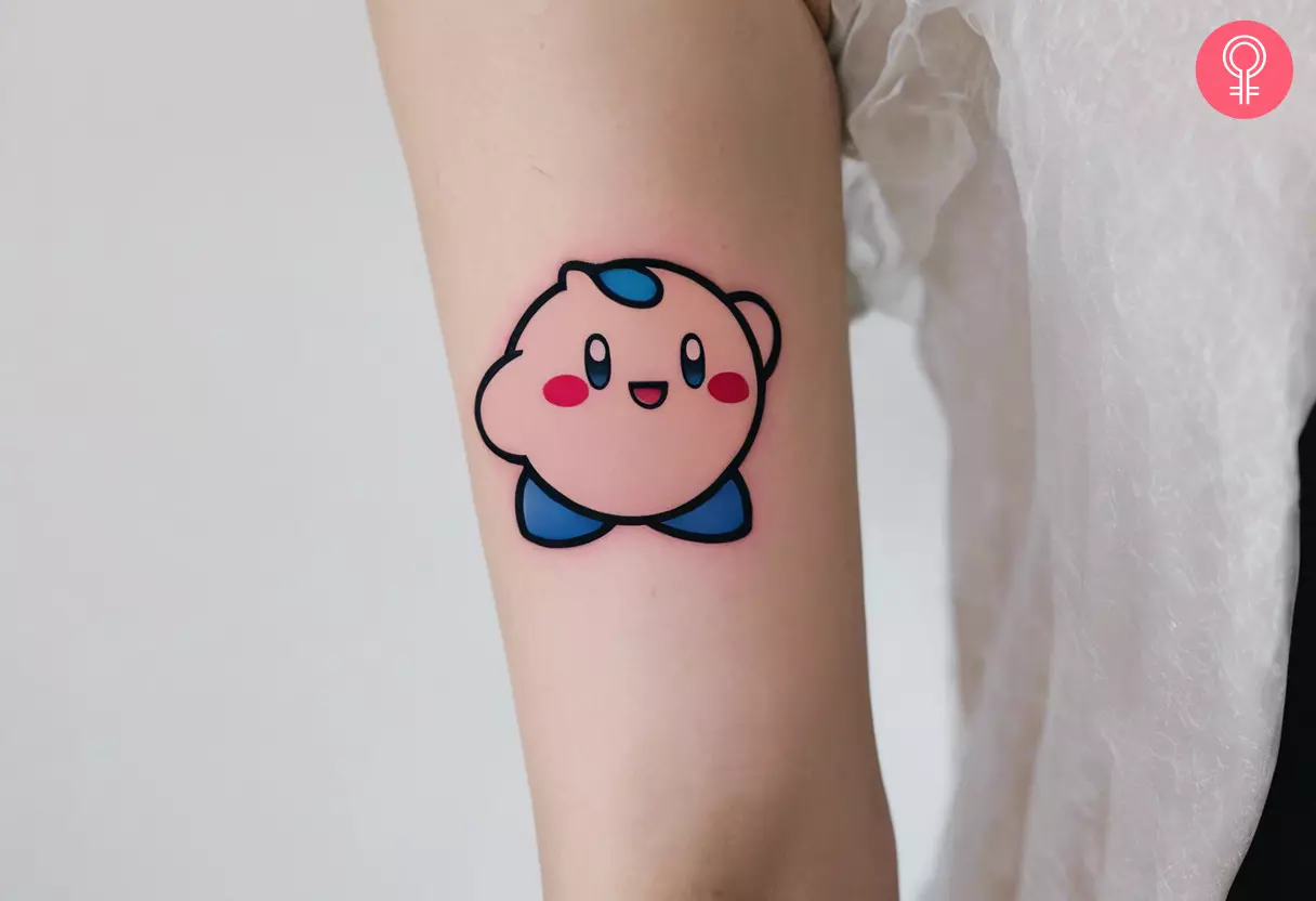 Kirby flash tattoo on the upper arm