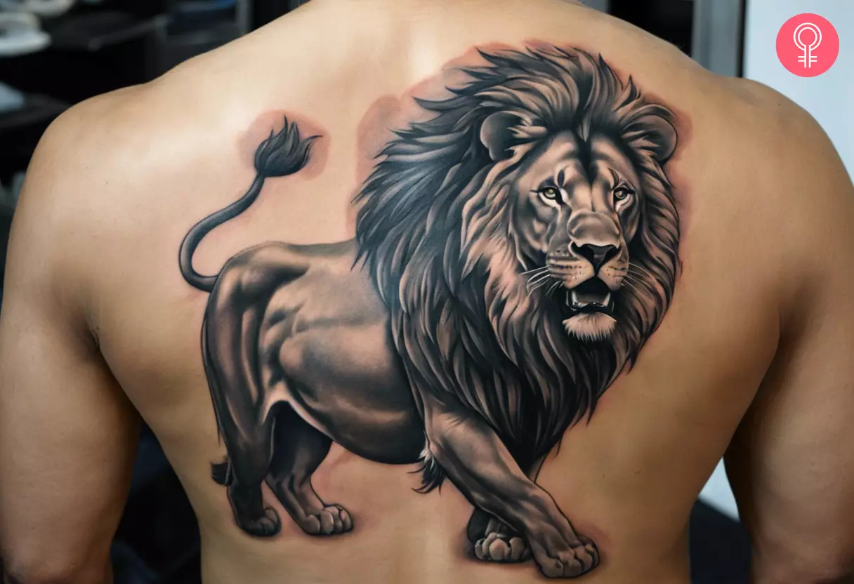 A man with a lion statue tattoo