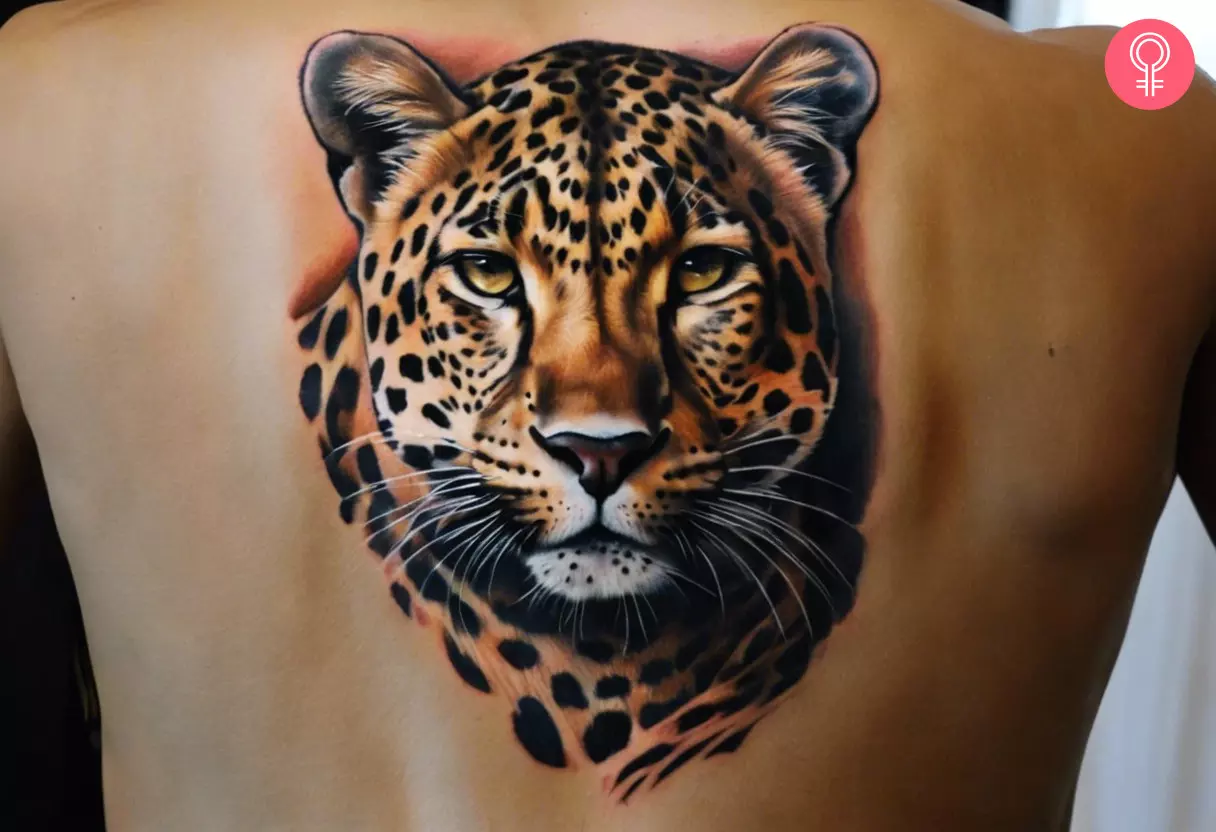 Man with a realistic leopard tattoo on his back