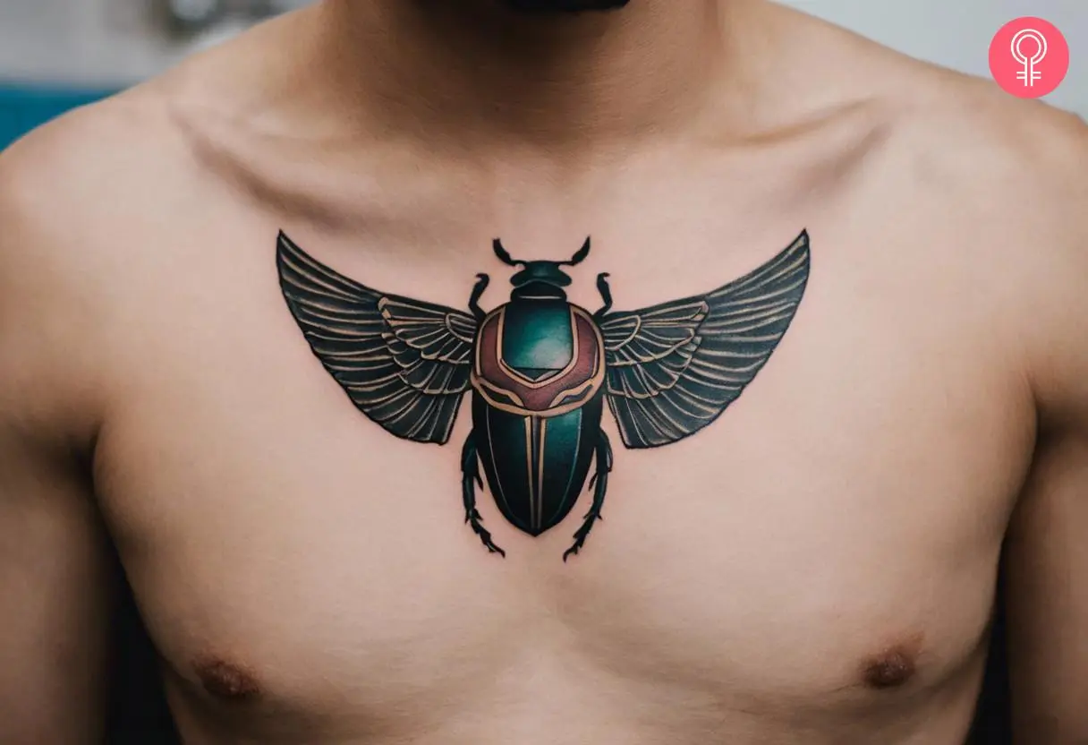 Man with scarab chest tattoo