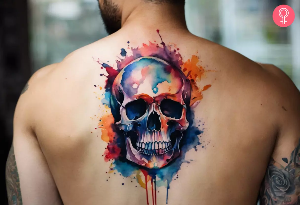 Man with skull tattoo in watercolor style on his back