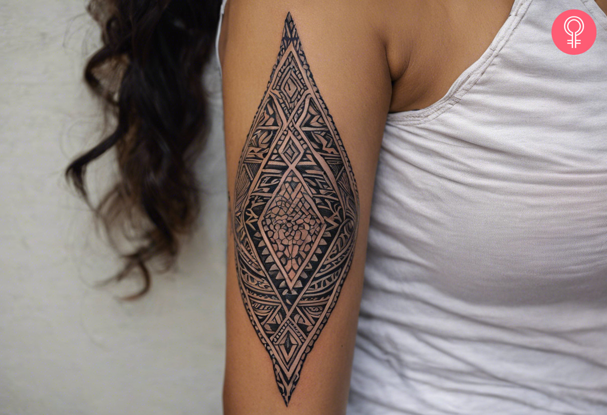 Maori diamond female tattoo on the upper arm