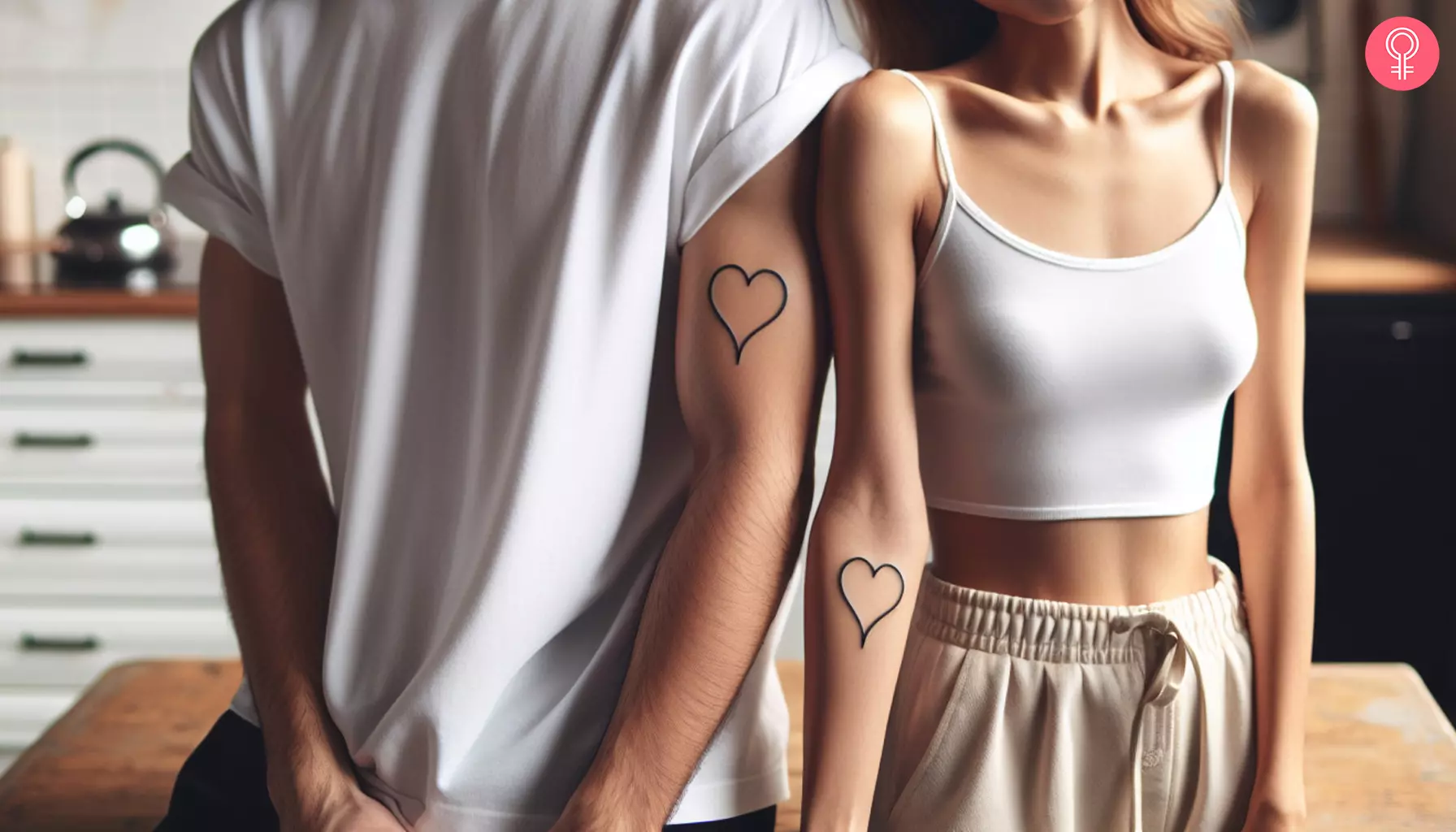 Matching line heart tattoos inked on the forearms of a couple