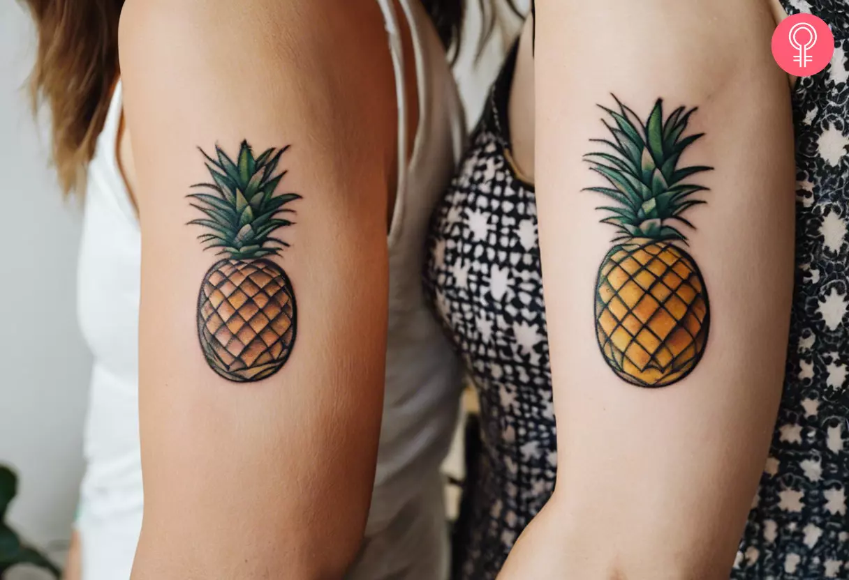 Matching pineapple tattoos on two friends' forearms