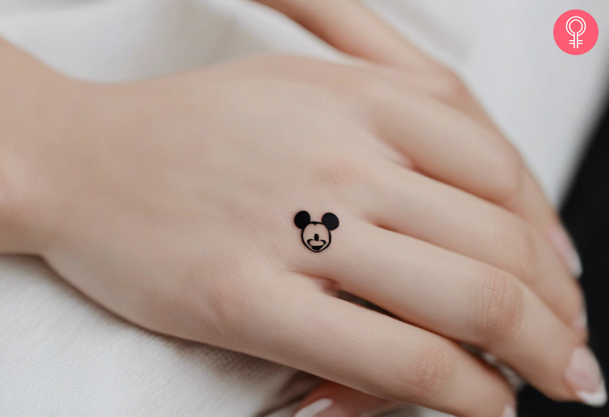 Mickey Mouse tattoo on the hand