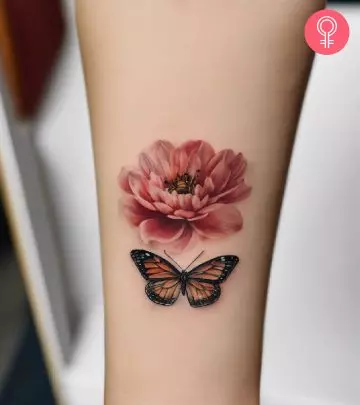 A woman wearing water lily flower tattoo on the back