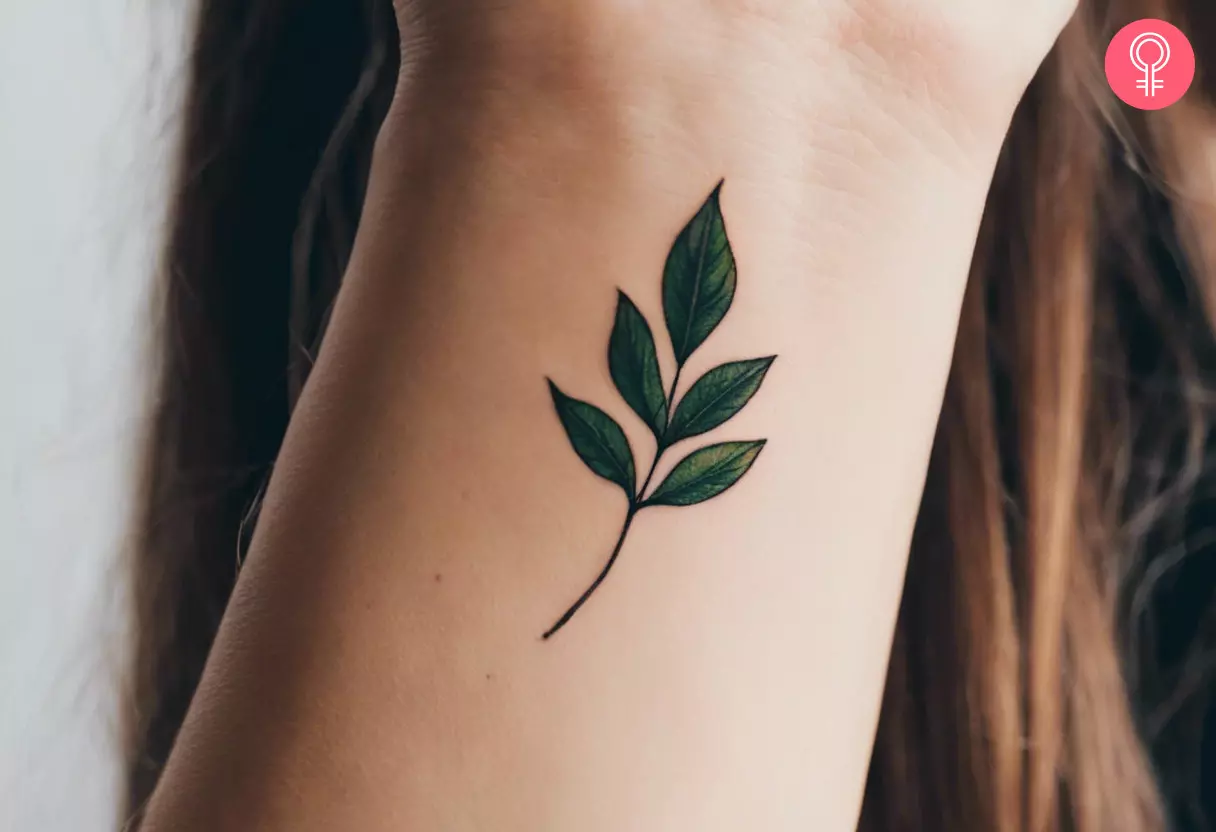 Minimalist leaf tattoo on the wrist