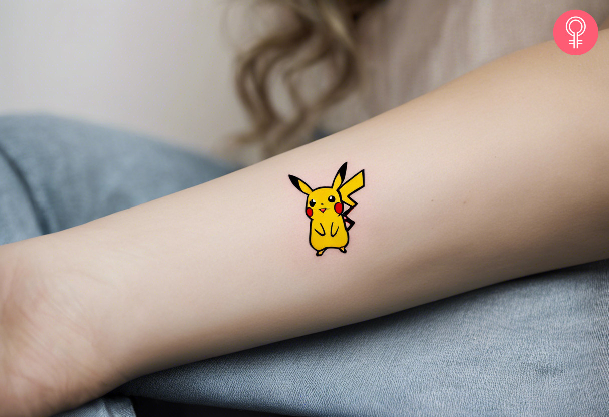 Minimalist Pikachu tattoo on a woman’s forearm