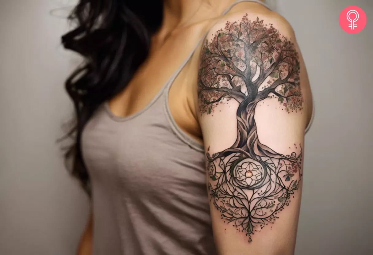 Woman with a Mother Nature Tree Of Life tattoo on the upper arm