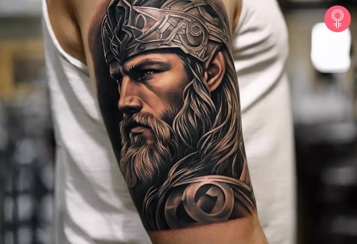 A Norse Thor tattoo on a man’s upper arm