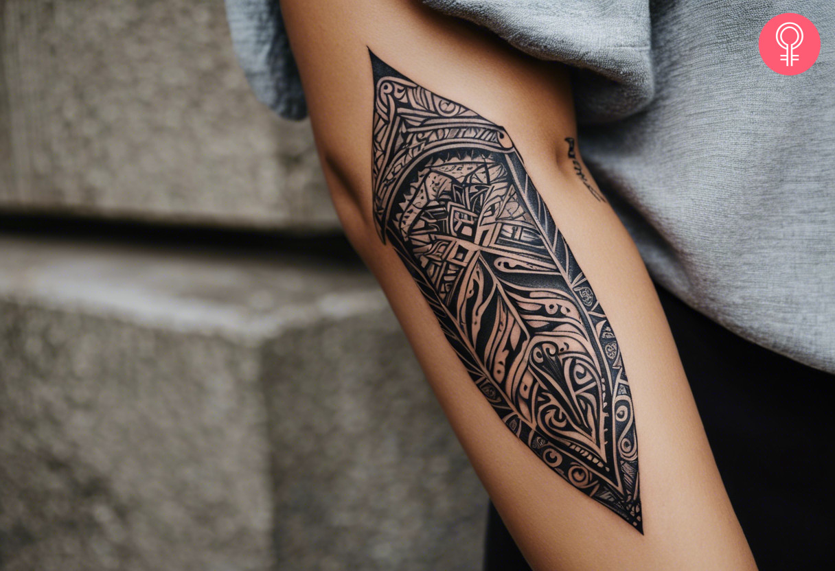 Oblong maori tribal tattoo on the forearm of a woman