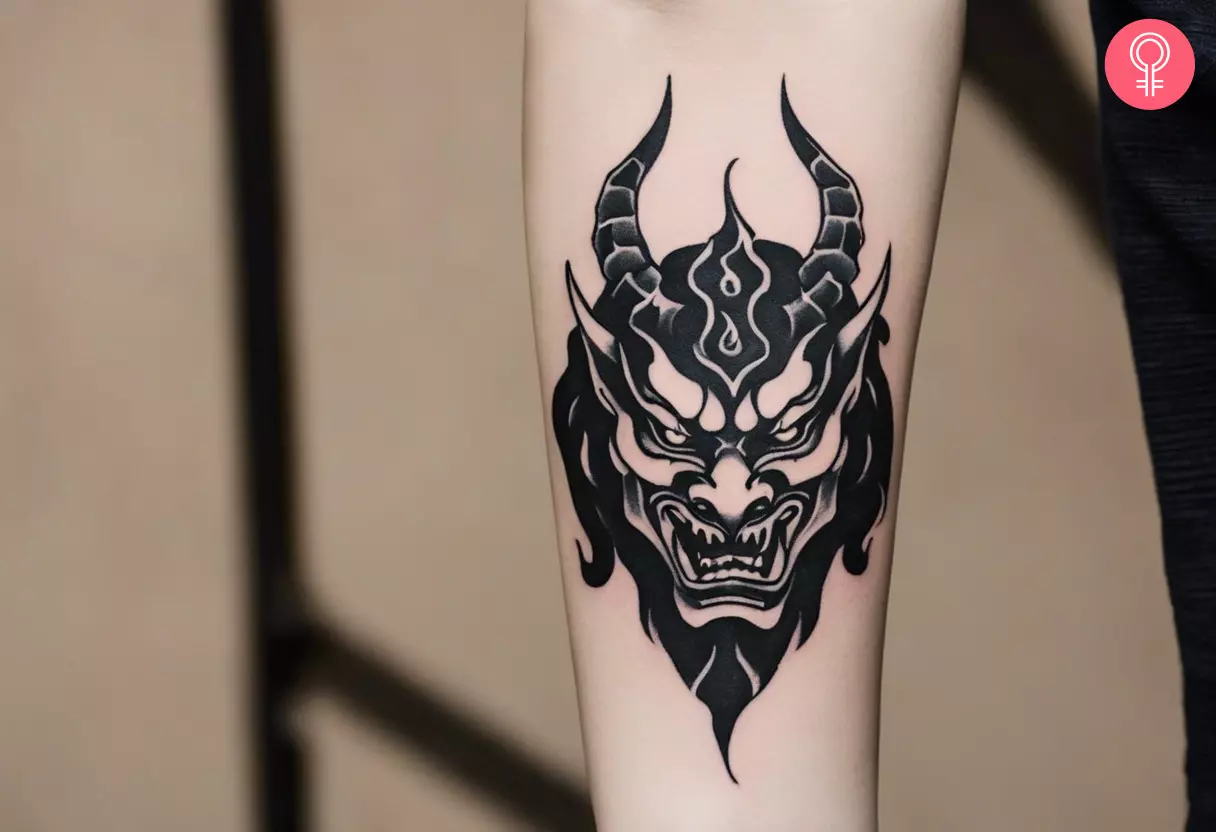 Oni demon tattoo on the forearm