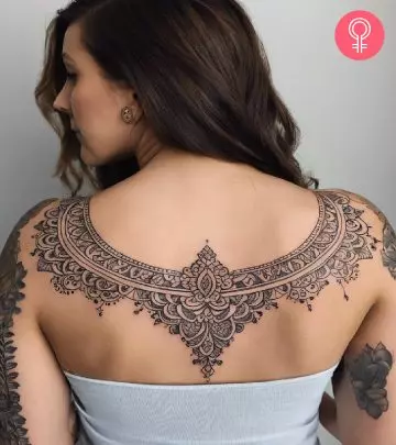 A woman with running tattoo on her shoulder