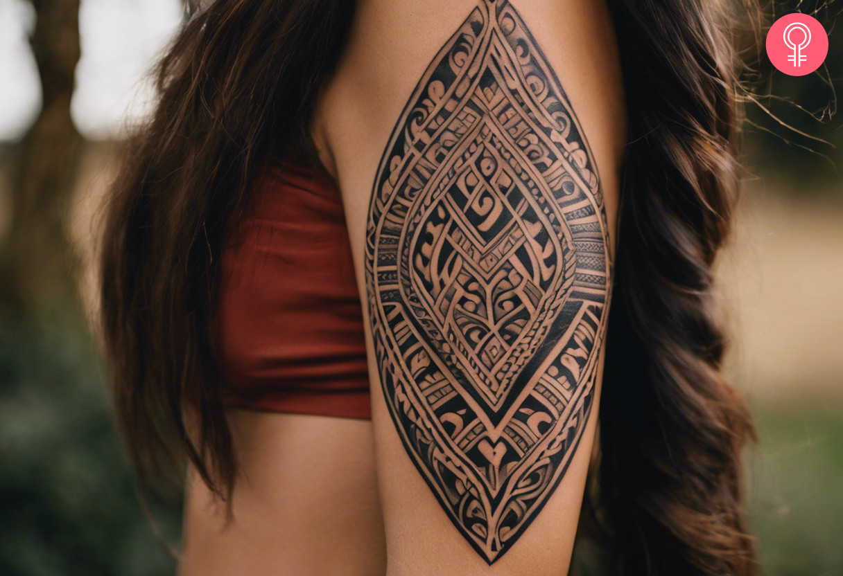 Ovoid maori traditional tattoo on the upper arm