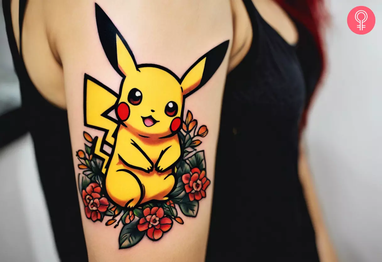 A woman with a cute, vibrant Pikachu tattoo on her upper arm