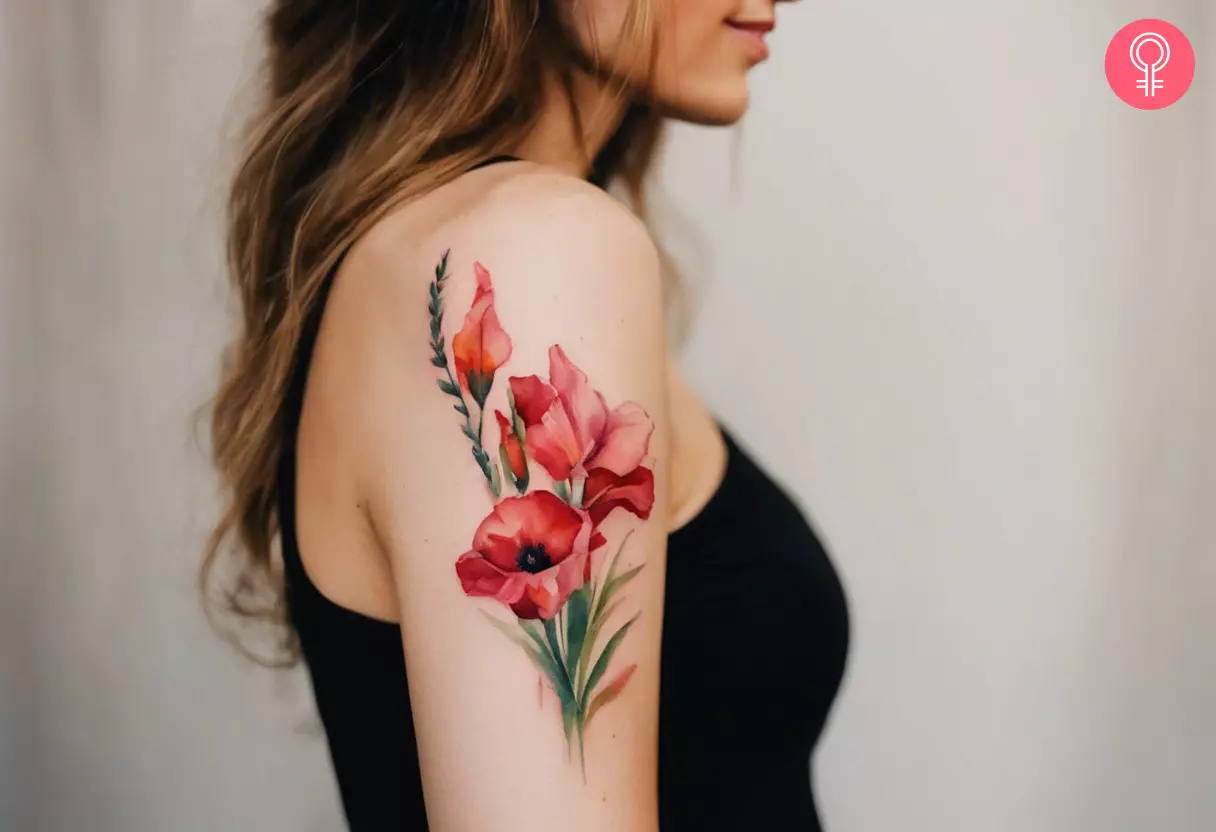 Poppy and gladiolus flowers tattoo on the upper arm