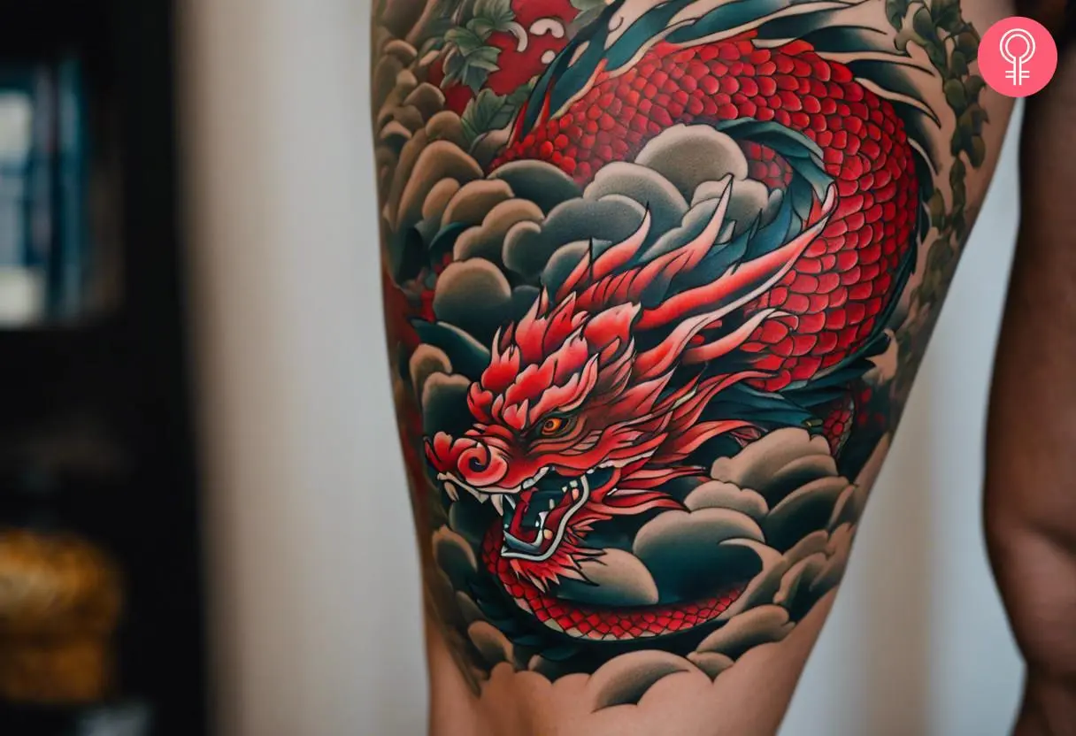 Red dragon tattoo on the thigh