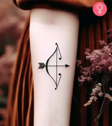 A Neptune tattoo design on the arm of a woman