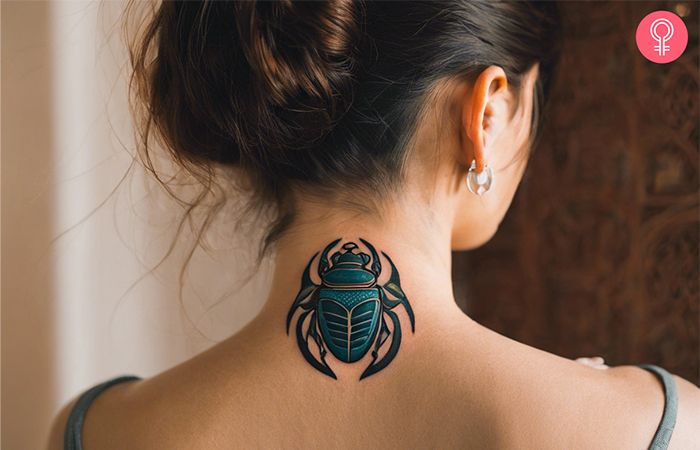Scarab tattoo at the back of the neck