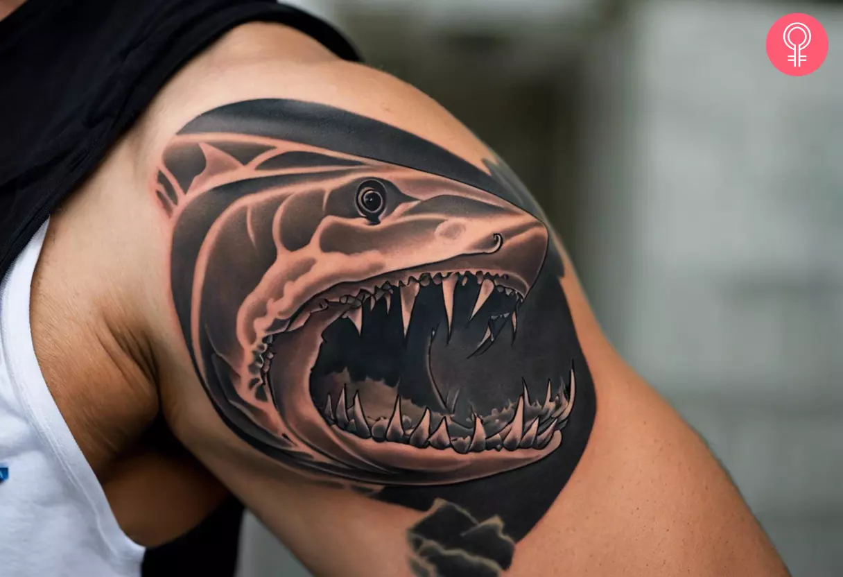 Shark jaw tattoo on the arm of a man