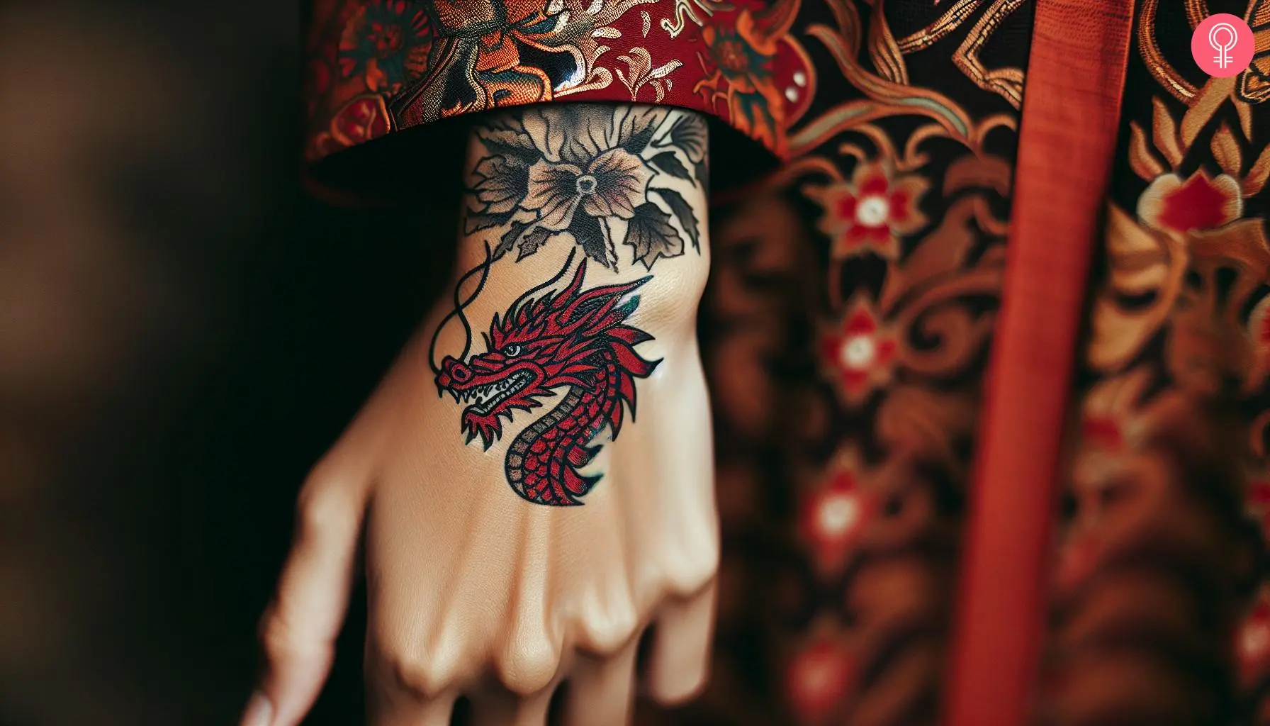 Simple red dragon tattoo on the hand