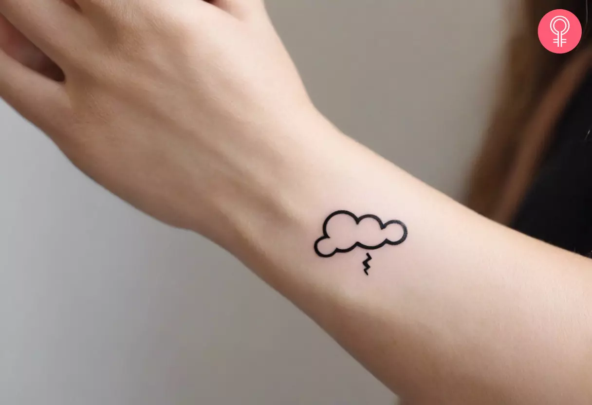 Simple storm cloud tattoo on wrist  