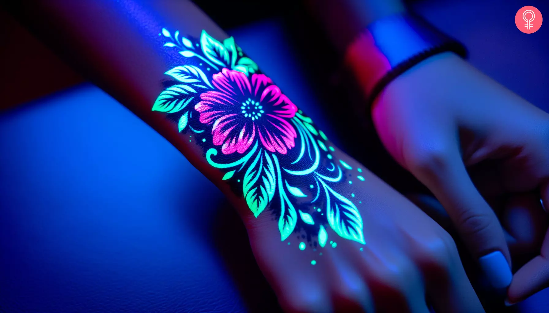 A stunning floral UV tattoo on the hand of a woman