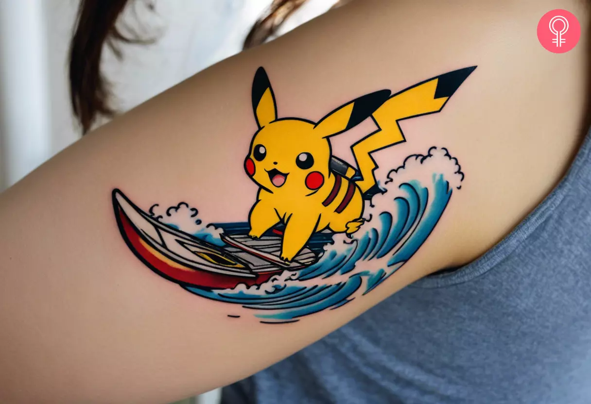 A woman with a surfing Pikachu tattoo on her upper arm
