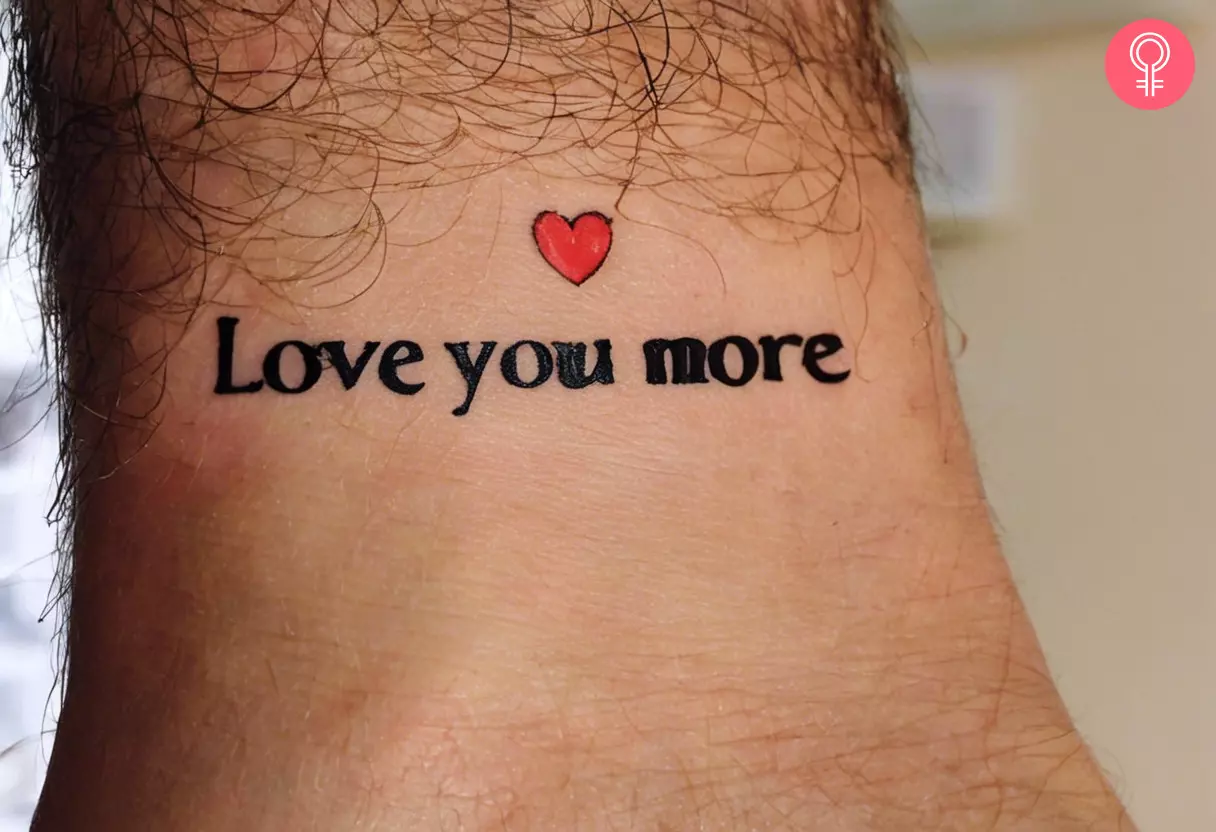The text Love you More with a heart inked on the wrist