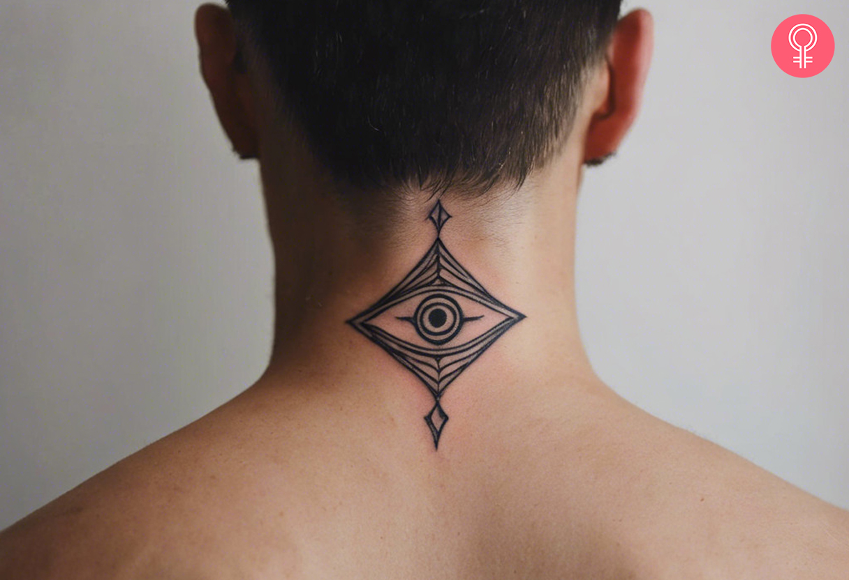 Third eye symbol tattoo on the nape of the neck of a man