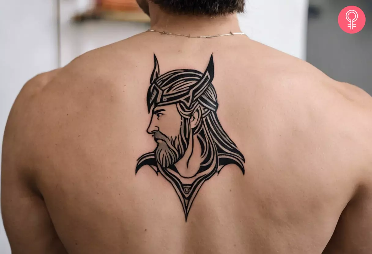 A man wearing a Thor tattoo on his back