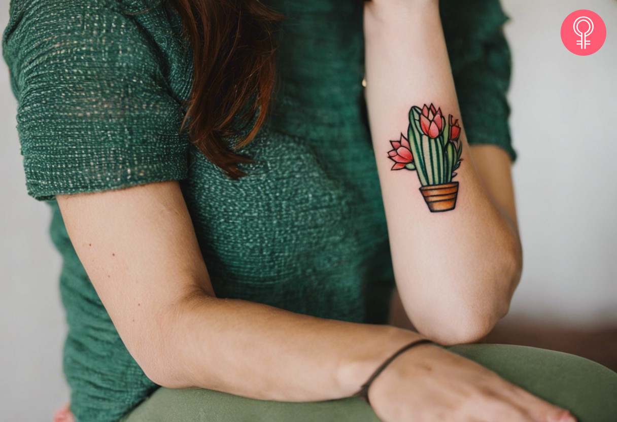 A traditional cactus tattoo on the forearm