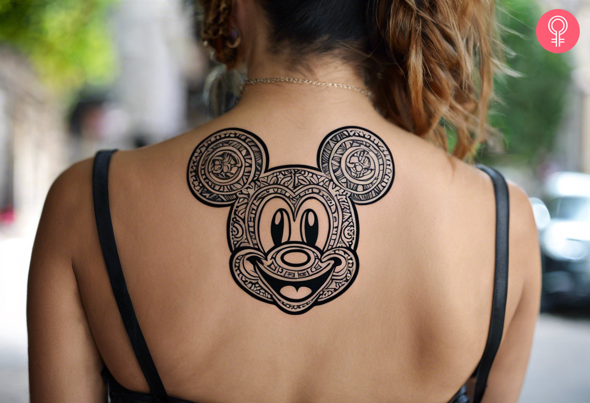 Tribal Mickey Mouse tattoo on the back