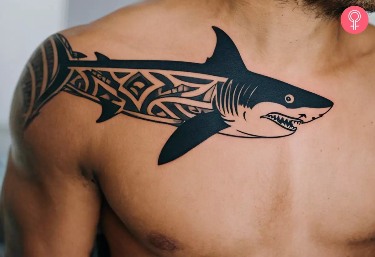 Tribal shark tattoo near the collarbone