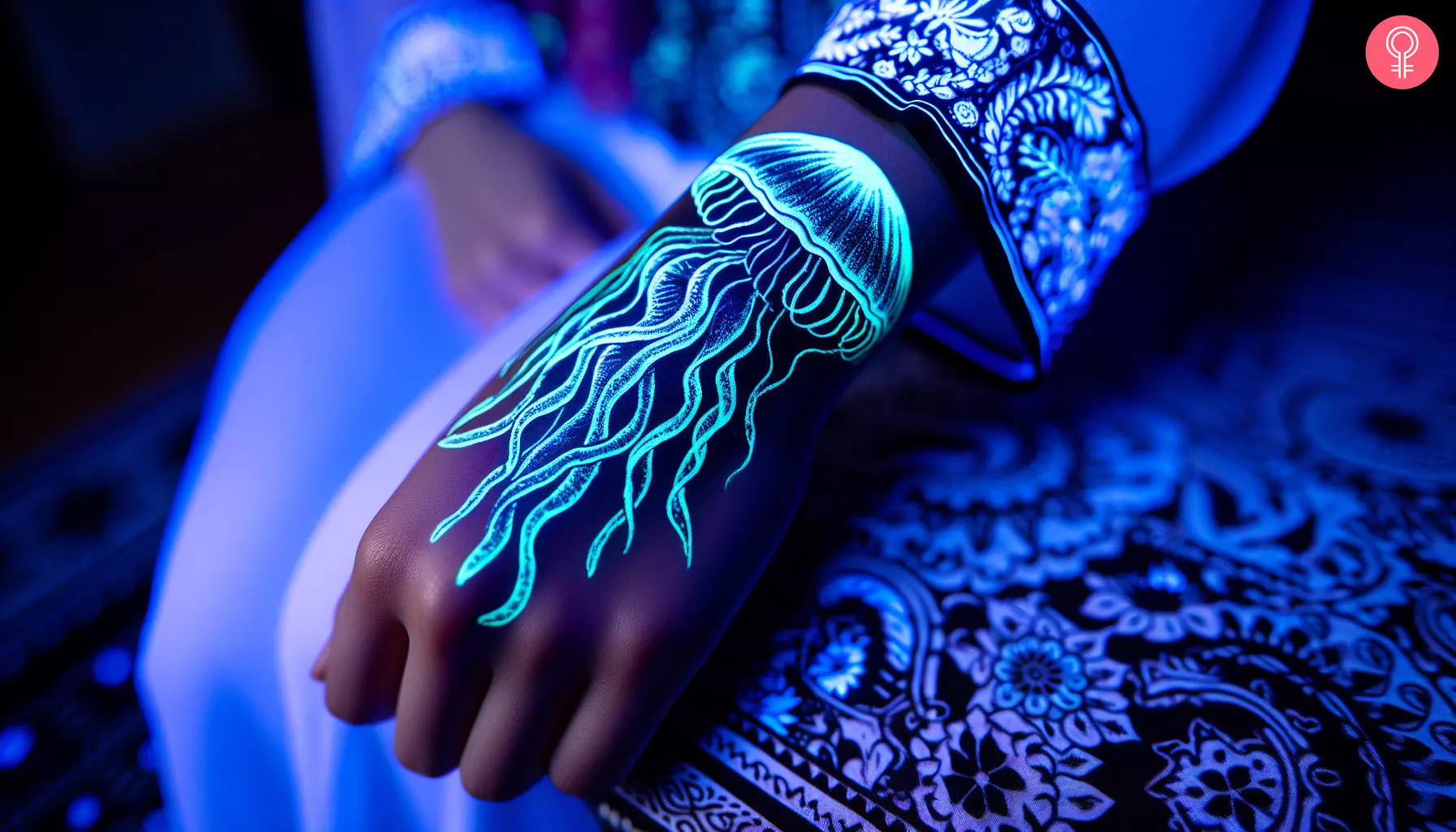 A UV jellyfish tattoo on the hand of a woman