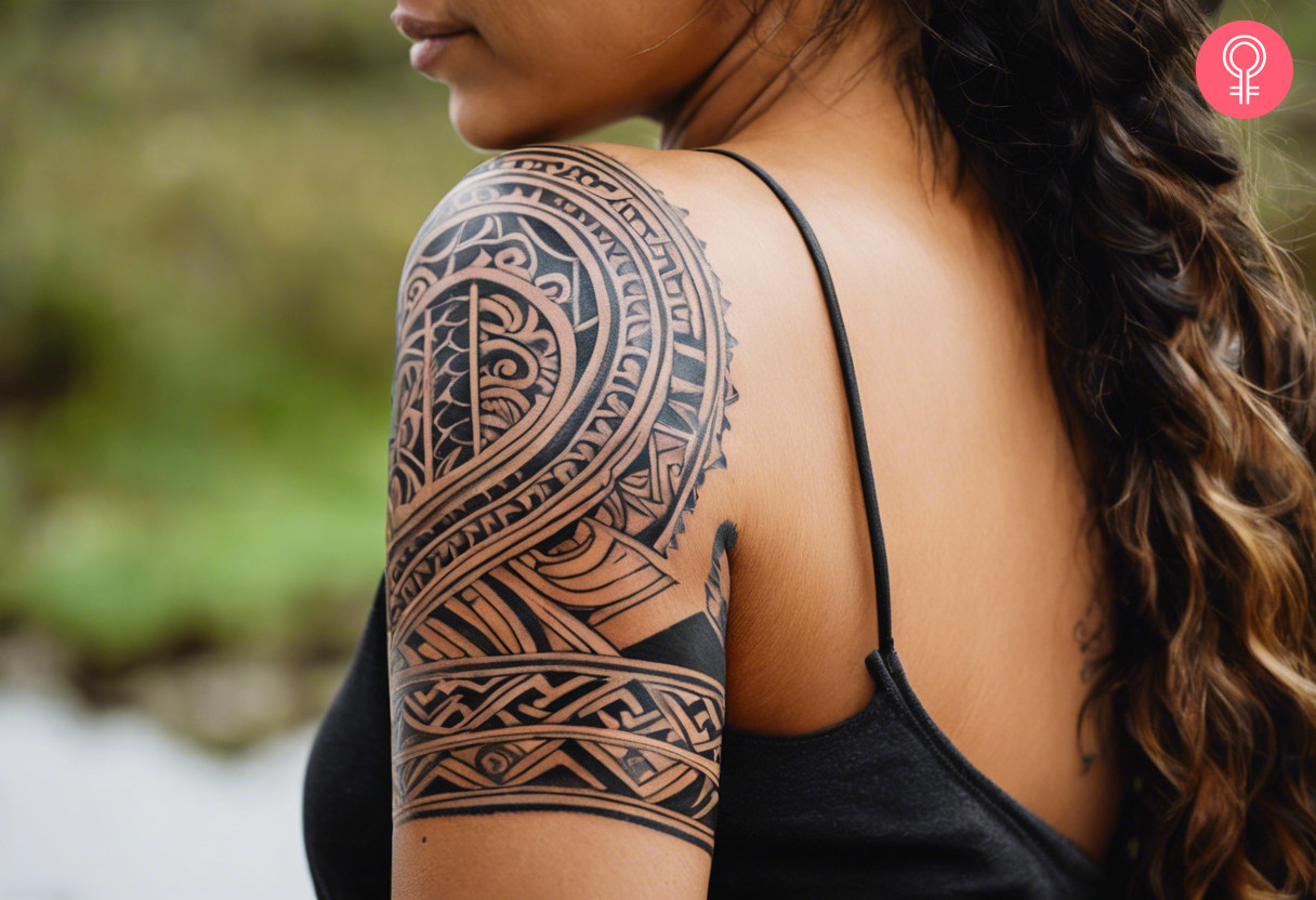 Upside down leaf maori tattoo on the shoulder of a woman