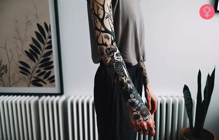 A woman with a wendigo tattoo sleeve