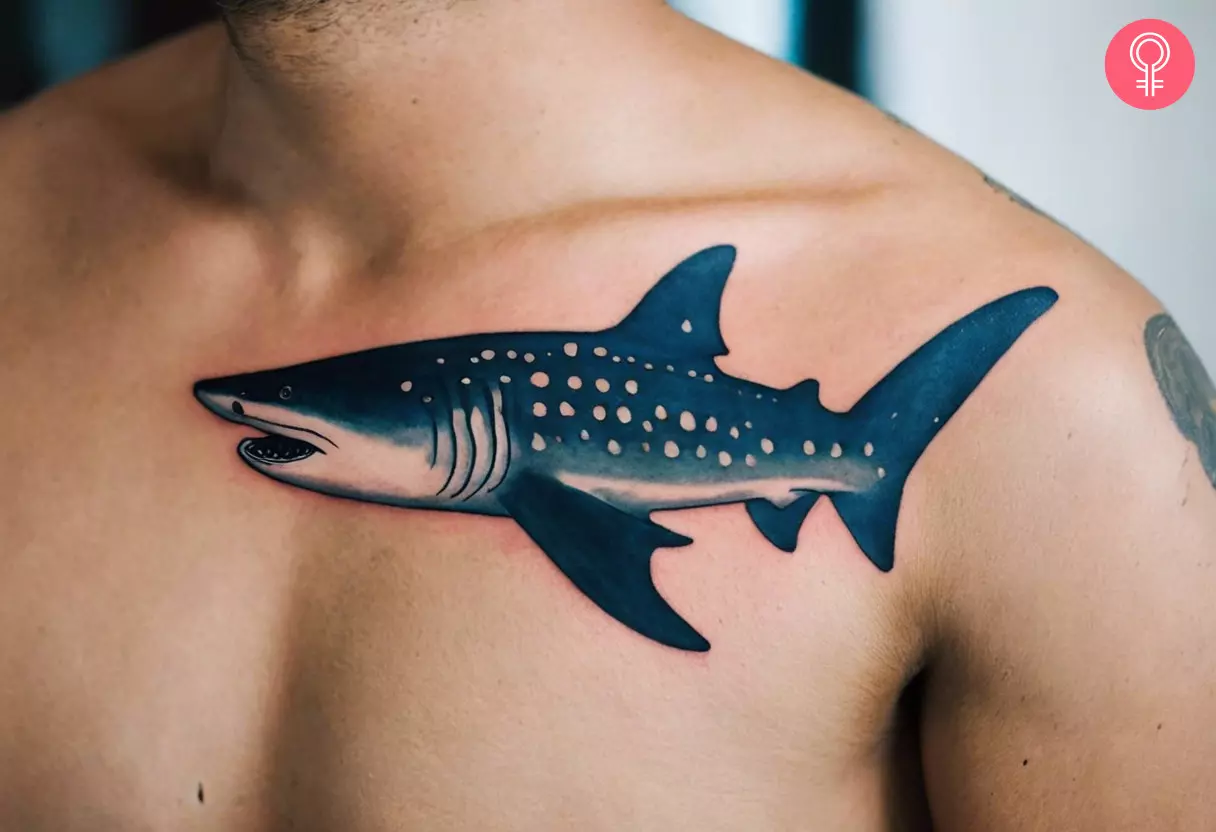 Whale shark tattoo near the collarbone of a man